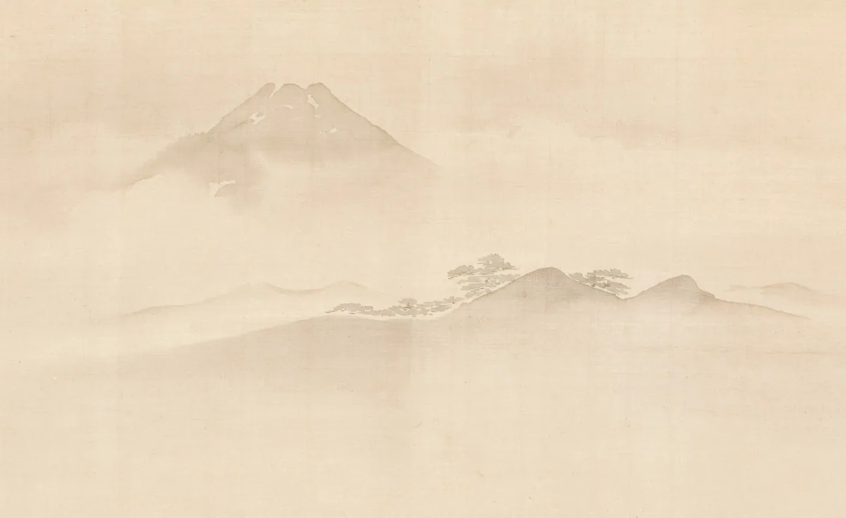 Soft mist rolling over a quiet mountain ridge at dawn
